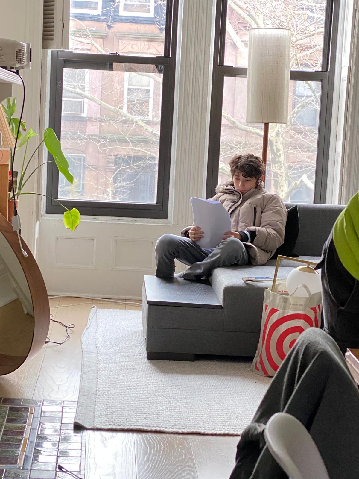 Nicolás Devoto studying a script between takes